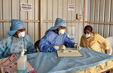 An Indian woman who recently returned from the United States being examined by doctors at a novel coronavirus help desk at a hospital in Hyderabad. (Photo | Vinay Madapu, EPS)