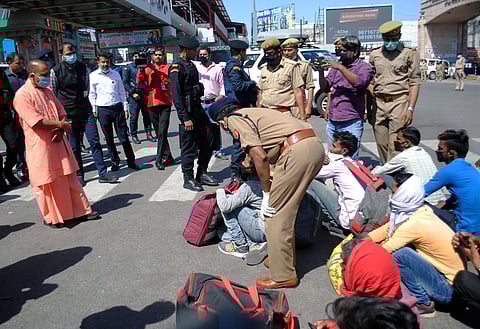 Uttar Pradesh Chief Minister Yogi Adityanath meets migrant workers from various states during a nationwide lockdown in the wake of coronavirus pandemic at Awadh Chauraha Alambagh in Lucknow Sunday March 29 2020. (Photo | PTI)