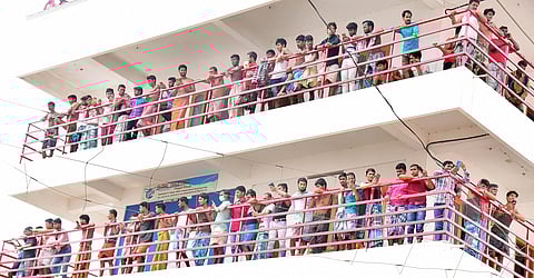 Guest migrant workers who took to the streets violating lockdown restrictions demanding return to their hometown at Payippad Junction near Changanassery on Sunday.(Photo| EPS/Shaji Vettipuram)