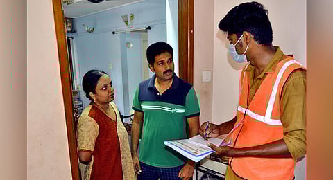 A Health Department employee conducting door-to-door enquiry in Mylapore  on Sunday. (Photo | EPS/D Sampath Kumar)
