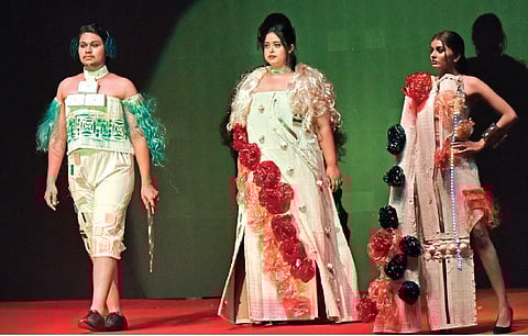 The students transformed unconventional materials like plastic garbage bags, tin foil, Styrofoam, metal wires, paper, PVC, foam board and bamboo mats into stunning pieces of wearable art.