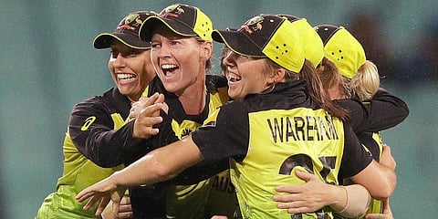 Australian teammates celebrate after winning their Women's T20 World Cup cricket semifinal match against South Africa in Sydney. (Photo | AP)