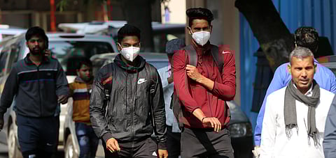 People wearing a protective mask in the wake of novel coronavirus or COVID-19 outbreak at Safderjung Hospital in New Delhi on Wednesday. (Photo | Shekhar Yadav/EPS)