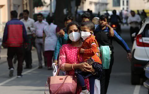 People wearing a protective mask in the wake of novel coronavirus or COVID-19 outbreak at Safderjung Hospital in New Delhi on Wednesday. (Photo | Shekhar Yadav, EPS)