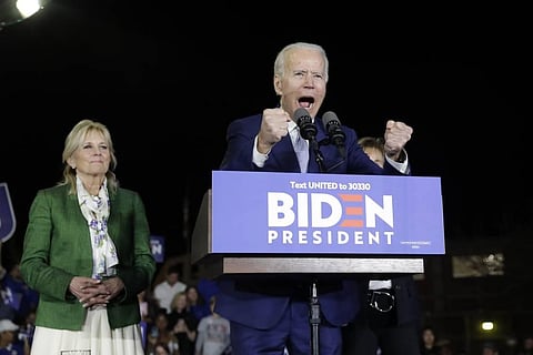 Democratic presidential candidate former Vice President Joe Biden, right, speaks next to his wife Jill during a primary election night rally in Los Angeles. (Photo | AP)