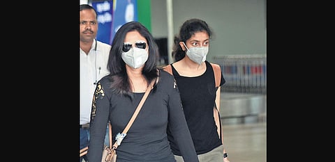 As coronavirus fear grips the country, passengers arrive at Biju Patnaik International Airport wearing mask in Bhubaneswar on Wednesday. (Photo | Biswanath Swain, EPS)