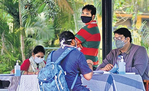 Staffers take preventive measures while attending to patients at Rajiv Gandhi Institute of Chest Diseases in Bengaluru on Wednesday | shriram BN