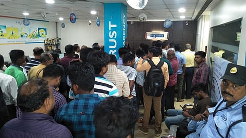 Customers stand on a long queue inside an Yes Bank branch in Bhubaneswar. (Photo| Biswanath Swain, EPS)