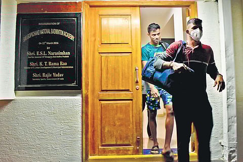 Doubles specialists Satwiksairaj Rankireddy (with mask) and Chirag Shetty leave the Gopichand Badminton Academy in Hyderabad on Thursday | S Senbagapandiyan