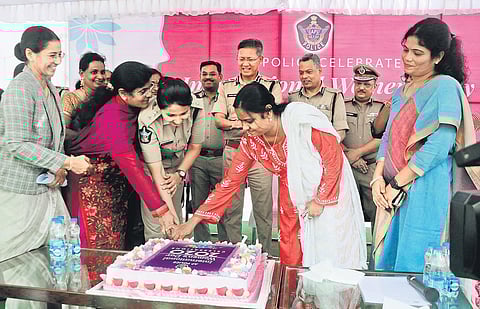 Women officers working in police headquarters cut a cake marking International Women's Day (March 8) at State Police Headquarters in Mangalagiri on Friday I Prasant Madugula