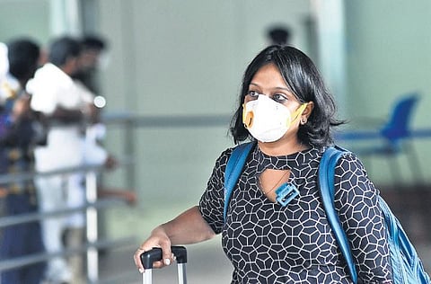 A passenger at the Chennai airport with her face mask on Friday | Ashwin prasath