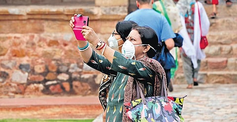 People wear protective masks as a precaution against the coronavirus outbreak in New Delhi on Thursday. (Photo | Ashish Kumar Kataria, EPS)