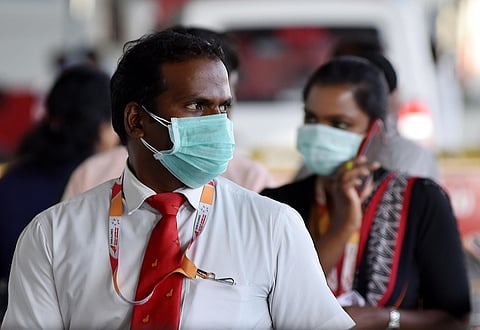 Airport staff wearing face mask to avoid coronavirus. (Photo | R Satish Babu/EPS)