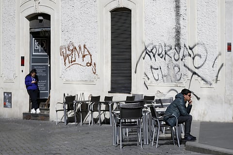 A man sits at a table as others are empty at a cafe in Largo Argentina square amid growing concern about the spread of a new coronavirus in Rome Saturday, March 7, 2020. (Photo | AP)