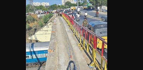 The spot where the motorists fell during wee hours of Sunday. Metal barricades did little to prevent the mishap. (Photo | D Sampathkumar, EPS)
