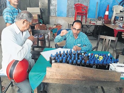 A man buys medicines from a homeopathy dispensary in Dhenkanal town | Express