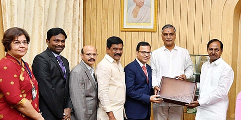 Telangana Finance Minister T Harish Rao presenting a copy of state budget to CM K Chandrasekhar Rao before presenting it in the Assembly. (Photo| EPS)