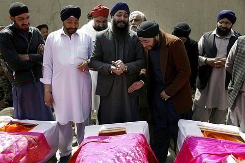 Afghan Sikh men mourn their beloved ones during a funeral procession for those who were killed by IS terrorist attack inside a Gurudwara in Kabul, Afghanistan. (Photo | AP)