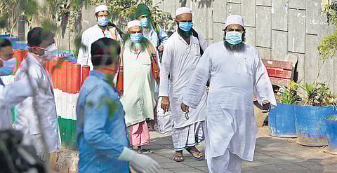 Evacuees from Markaz Nizamuddin being taken to LNJP hospital in New Delhi for COVID-19 test on Tuesday; doctors and cops outside the Tablighi Jamaat HQ  | Anil Shakya