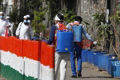 Municipal corporation of delhi staff sanatize the Nizamuddin area on Tuesday. (Photo | Anil Shakya/EPS)