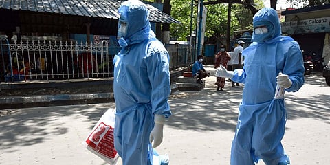 Health officials dressed in protective suits and masks at NRS hospital during a government-imposed lockdown as a preventive measure against the coronavirus, in Kolkata. (File photo| ANI)