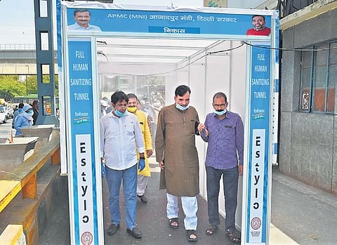 Delhi Minister Gopal Rai walks through the disinfectant tunnel | Parveen Negi