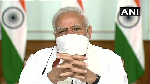 Prime Minister Narendra Modi seen wearing a mask during video-conferencing with the Chief Ministers. (Photo | ANI)