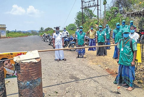 Residents of Pachamalai hills have banned entry of outsiders to their villages, and vehicles going out are sprayed when they return | Express