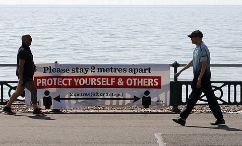 Stole's walk along the promenade on a warm and sunny day after the coronavirus outbreak and lockdown in Brighton, England. (Photo | AP)