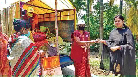 Members of the group delivering vegetables to villagers. (Photo | EPS)