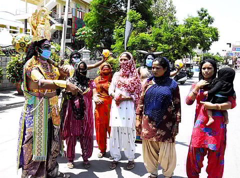A man dressed as Yamaraj warns Tirupati locals to stay indoors. (Photo | Madhav K, EPS)