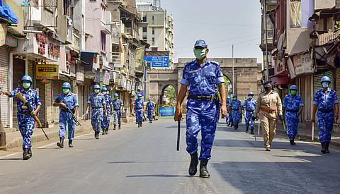 RAF personnel patrol a street and urge people to remain indoors during a nationwide lockdown to slow the spreading of coronavirus in Ahmedabad Saturday April 11 2020. (Photo | PTI)