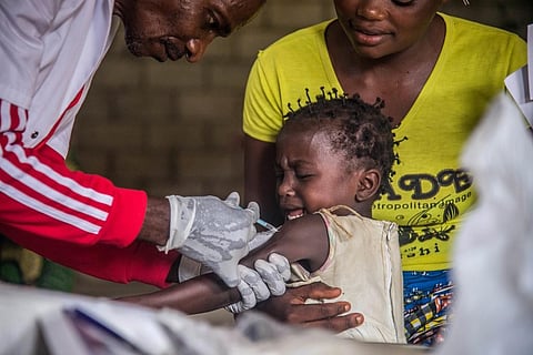 A toddler undergoes measles vaccination. (Photo| AFP)