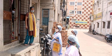 Asha workers checking the health condition of people at a containment zone in Secunderabad. (Photo | Sathya Keerthi, EPS)
