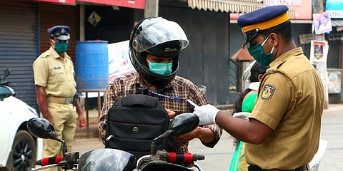 Kerala cops interrogating a two-wheeler rider (Photo |  TP Sooraj, EPS)