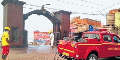 The entrance of Swargadwar being sanitised by fire personnel  (Photo | EPS)