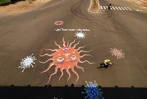 A massive painting at Rajmahal square to create awareness among people on coronavirus during lockdown in Bhubaneswar on Thursday. (Photo | Biswanath Swain, EPS)