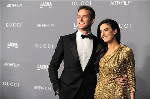 Armie Hammer, left, and Elizabeth Chambers arrive at the 2012 ART   FILM GALA hosted by LACMA on Saturday, Oct. 27, 2012, in Los Angeles. (Photo by Jordan Strauss/Invision/AP)