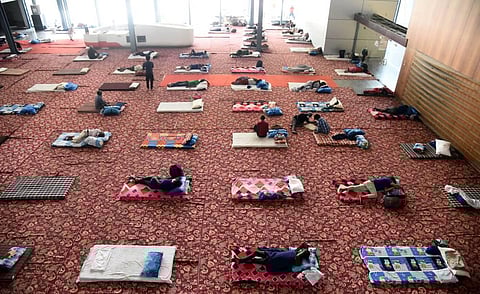 Migrants at Yamuna Sports Complex which has been converted into a temporary shelter for those in need during the government-imposed nationwide lockdown. (Photo | Parveen Negi, EPS)