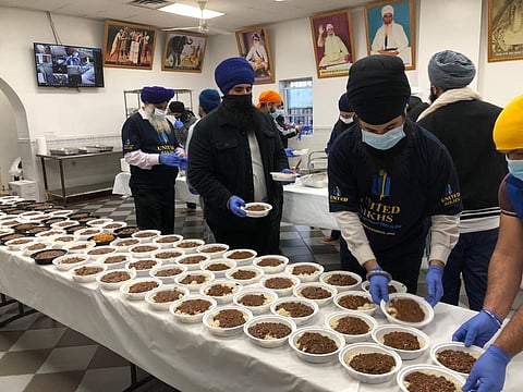 Volunteers packing food for the needy in New York (Photo | EPS)