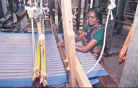 Traditional artisans engaged in handloom weaving at the Travancore Textiles in Thiruvananthapuram,PicsVincent Pulickal