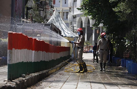 Delhi fire service staff sanitize the Nizamuddin area in New Delhi on Friday. (Photo | Anil Shakya, EPS)