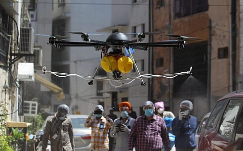 South Delhi Municipal corporation staff  use drone to spray disinfectant in nizamuddin area on Friday. (Photo | Anil Shakya, EPS)