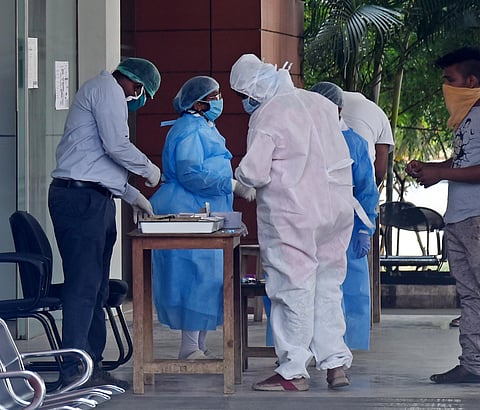 Doctors And Nurses seen working with Personal Protective Equipment PPE. (Photo | A Raja Chidambaram/EPS)