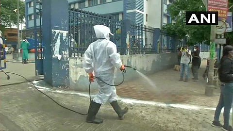 Disinfectants are being sprayed outside M R Bangur Super Speciality Hospital in Kolkata. (Photo | ANI)