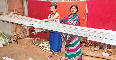Gobardhan Panika and his wife Jemma at the pit loom