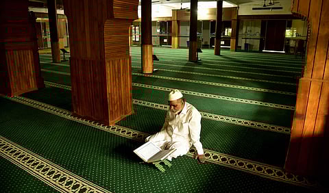 Abdhul Hameed Musliyar, the muezzin of Muaddun Juma Masjid, Kaloor, recites Quran on the eve of the start of the holy month of Ramzan. Hundreds used to perform namaz at the masjid before the Covid outbreak, but now he is all alone due to the lockdown rest