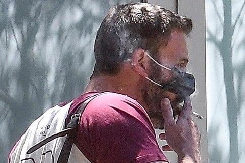 Ben Affleck smoking with mask. (Photo | Twitter/@pagesix)