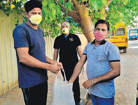 In Pune, a group of Odia professionals have dared the pandemic to spread ‘happiness’ among migrant workers from Odisha left stranded and fending for themselves.