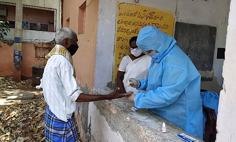 Medical staff conducting COVID-19 rapid test in Vijayawada. (Photo | Express)